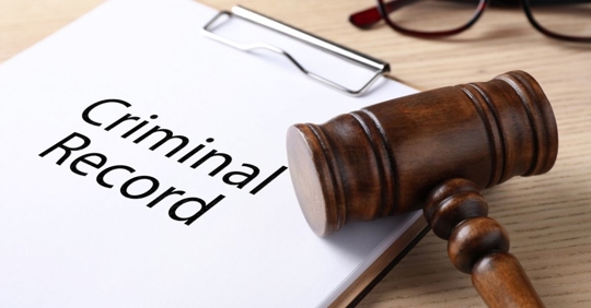 criminal record documents and a gavel