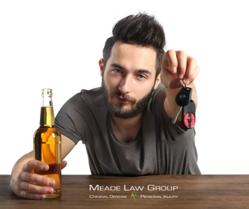 man drinking and drunk looking hands over his keys