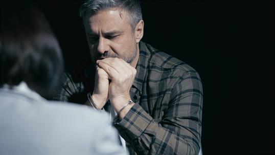 arrested man talking with lawyer