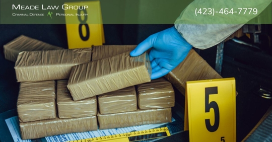 drug bricks in pile with numbers for forensic evidence